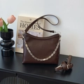 Dark coffee leather bucket bag with silver decorative chain and adjustable strap - Coffee