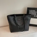 Minimalist black woven large capacity tote bag with long handles and chic texture - Black