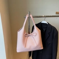Large pink tote bag with bow detail and woven texture for casual use - Pink