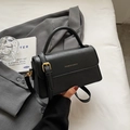 Chic black leather handbag with gold 'FASHION & BAGS' lettering and adjustable strap - Black