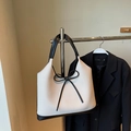 Straw tote bag with black leather contrast trim and a large decorative bow detail - White and Black Splicing