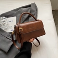 Vintage brown leather crossbody handbag for women with gold hardware and top handle - Brown