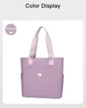 Close-up of purple oxford tote bag featuring front zipper pocket and side compartments - Purple