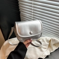 Silver semi-circle saddle crossbody bag with metallic finish and delicate texture - Silver