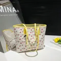 Sweet cherry print tote bag with yellow leather straps and cartoon charm detail - Yellow