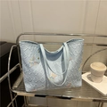 Light blue textured tote bag featuring butterfly sequins and dual shoulder straps - Blue