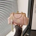 Pink floral shell bag with golden metal frame, top handle, chain and tassel detail - Pink