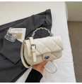 Elegant cream quilted crossbody bag with gold chain strap and metal turn-lock closure - White