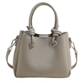 Macro detail of grey lychee textured leather handbag with decorative knot and metal buckle - No Pendant / Blue