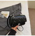 Classic black quilted leather crossbody bag with silver chain and metal turn-lock - Black