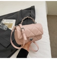 Quilted light pink crossbody bag with silver chain strap and metal turn-lock closure - Pink