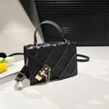 Classic black quilted leather handbag with gold lock and adjustable shoulder strap - Black