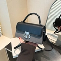 Schicke zweifarbige Handtasche mit schwarzem Ledergriff und grauem Twill-Körper - Schwarz