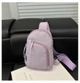 Detailed view of purple nylon crossbody bag with zipper compartments and adjustable strap - Purple