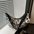 Artistic printed half-moon crossbody bag with panda charm and wide nylon strap - With Pendant / Black