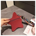 Detail of red star-shaped purse with pebble texture leather and LOVE webbing strap - Burgundy