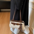 Chic beige and brown leather underarm bag with decorative ring and stylish charms - With Pendant / Off White