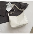 Detail of white matte leather tote bag with vertical stitching and gold zipper hardware - White