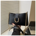 Close-up of black PU leather underarm bag featuring a metallic gold U-shaped buckle and strap - Black