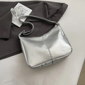 Silver metallic hobo shoulder bag with leather texture on grey background - Silver