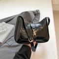 Glossy black hobo saddle bag with golden hardware and adjustable leather shoulder strap - Black