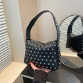 Black lychee leather rivet handbag with silver studs for a modern punk style look - Black