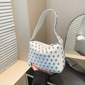 White studded underarm shoulder bag with silver rivet hardware and litchi grain texture - White