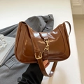 Brown glossy crescent underarm bag with vintage metal buckle and adjustable strap - Brown