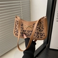 Chic leopard print shoulder bag with brown leather handles and gold bow accent - Khaki