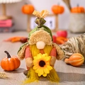 Harvest gnome plush with green plaid hat and sunflower, cozy autumn decor setup - Female Model With Sunflower