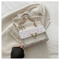 Chic white crossbody bag with pink floral and bow prints on a stylish gold chain - White