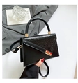 Elegant black faux leather handbag with crocodile pattern texture and gold lock clasp - Black
