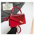 Elegant red crocodile texture handbag with gold hardware lock and adjustable strap - Red