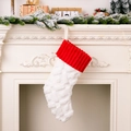 Red and white knit Christmas stocking with diamond pattern for holiday home decoration - White