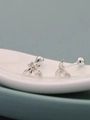 Macro detail of silver insect stud earring with pink zircon and screw back closure - Bee Shape-Pink Stone / Silver Plated Copper