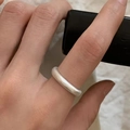 Minimalist adjustable open ring with a matte silver frosted finish shown on finger - Adjustable Open / Brushed Plain Silver