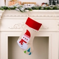 Rustic burlap Christmas stocking with snowman embroidery hanging on white fireplace - Snowman