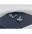 Macro view of snake-shaped ear studs with micro-paved crystals and green stone eyes - Silver Pave Snake Stud - Ball Back