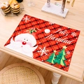 Christmas place mat with Santa Claus and red black plaid patterns for festive table decor - Red Green Plaid Snowflake Cartoon Placemat Red Santa