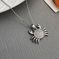 Silver ocean crab pendant necklace with micro-pave sparkling zircon on woven background - Crab Zircon Necklace / Silver