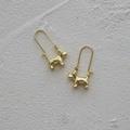 Symmetric gold Schnauzer dog earrings with hammered metal texture and long hooks - Gold