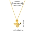 Dettaglio dei ciondoli girasole, stella e luna con misure su una catena dorata - Collana Girasole Stella Luna