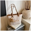 Detail of canvas bucket bag with brown leather trim and cute teddy bear charm - With Pendant / Brown