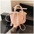 Pink lychee texture handbag with white lace bow and pearl pendant details - Pink