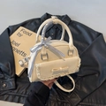 Cream square handbag with lace trim, bow detail, and ribbon-wrapped handle for women - Off White