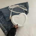 White heart-shaped crossbody bag with gold FASHION & BAG print and adjustable strap - White
