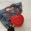 Chic red heart-shaped crossbody bag in matte PU leather with gold lettering and strap - Red