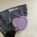 Chic heart-shaped crossbody bag in light purple with embossed edges and golden text - Purple