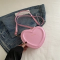 Pink heart-shaped crossbody bag made of smooth PU leather with golden fashion text - Light Pink