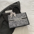Chic black and white printed canvas tote bag with leather handles and decorative silk scarf - Black